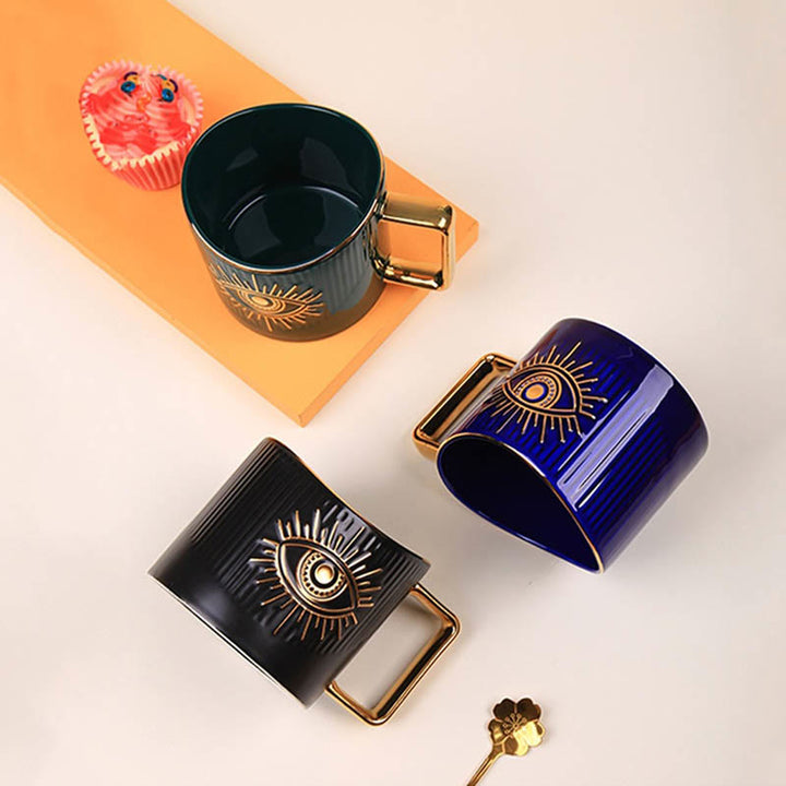 Tazza da caffè in ceramica con manico dorato e malocchio Olivenorma