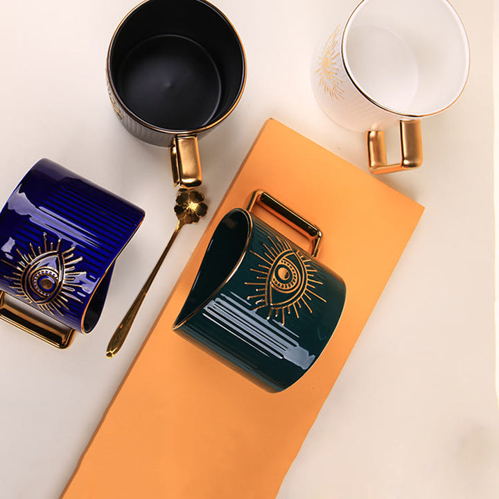 Tazza da caffè in ceramica con manico dorato e malocchio Olivenorma