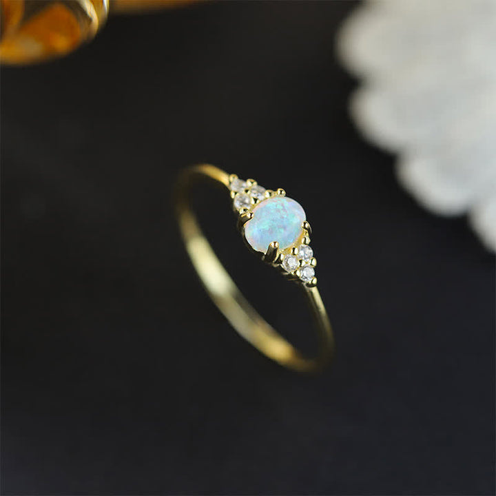 Anello Olivenorma in argento bianco con opale bianco e zircone semplice