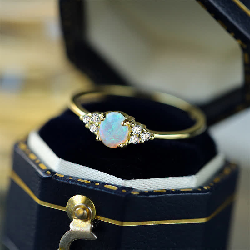 Anello Olivenorma in argento bianco con opale bianco e zircone semplice