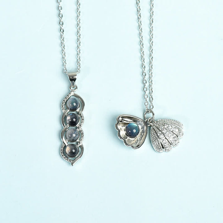 Collana con ciondolo a forma di pisello in conchiglia di labradorite Olivenorma, set di gioielli con fiocco di neve