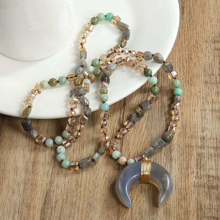 Collana con ciondolo a forma di mezzaluna in corno di bue con perline di cristallo naturale Olivenorma