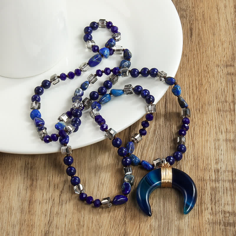 Collana con ciondolo a forma di mezzaluna in corno di bue con perline di cristallo naturale Olivenorma