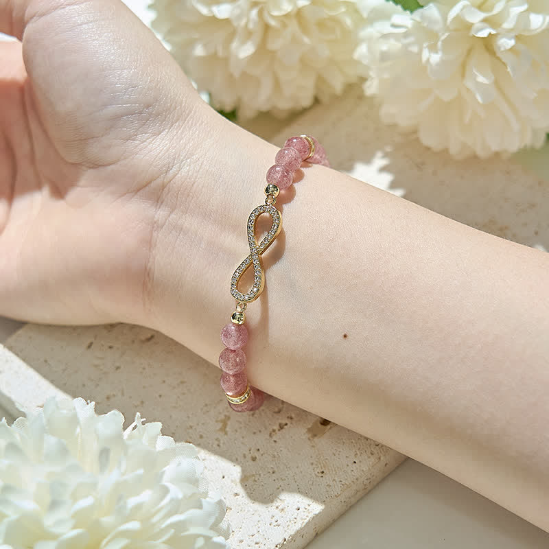 Bracciale con simbolo dell'infinito in perline di quarzo fragola naturale Olivenorma 