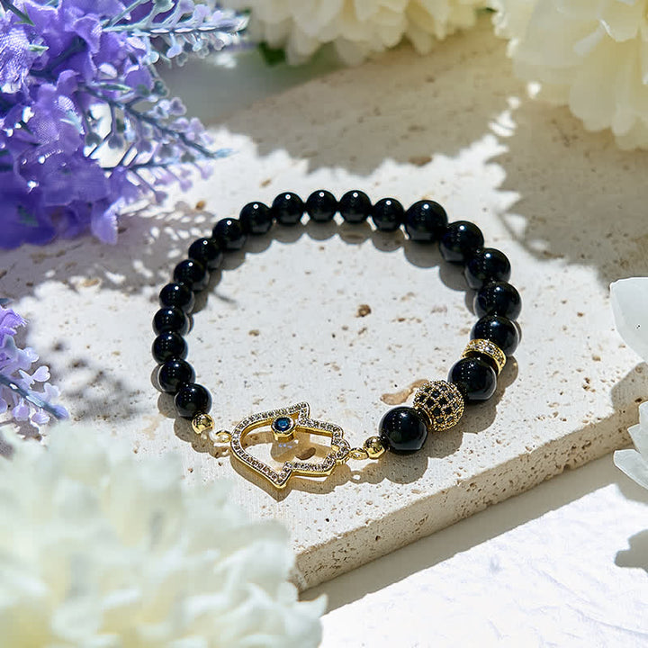 Olivenorma Bracciale con ciondolo Hamsa in perle di ossidiana naturale