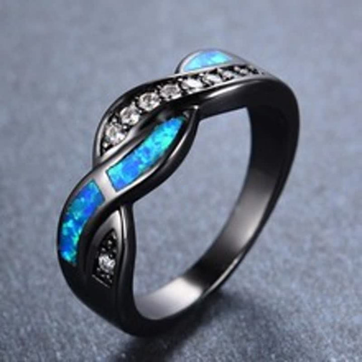 Anello Olivenorma in oro nero con opale blu ondulato e zircone