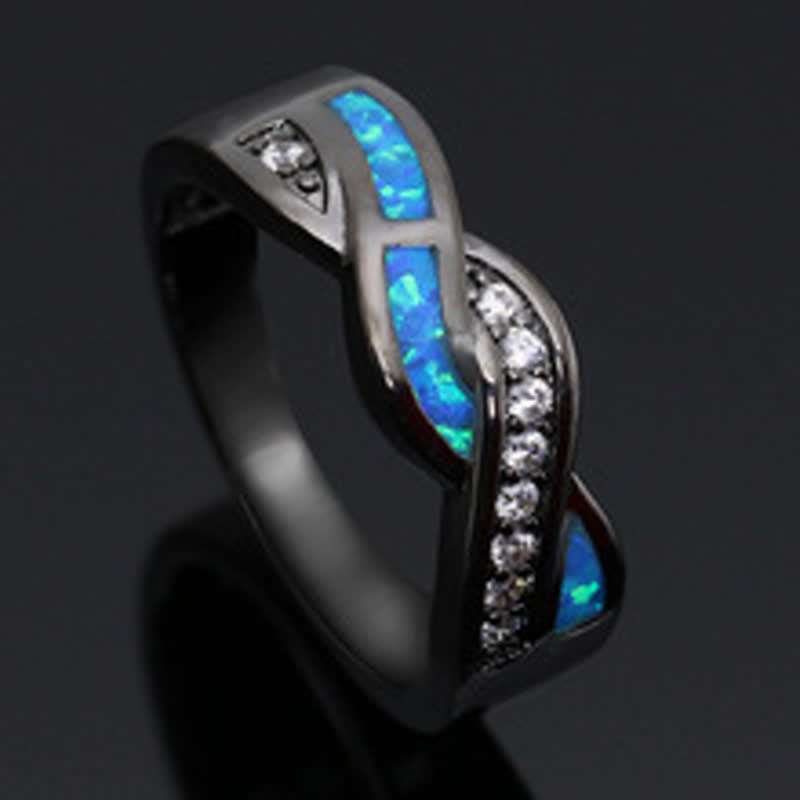 Anello Olivenorma in oro nero con opale blu ondulato e zircone