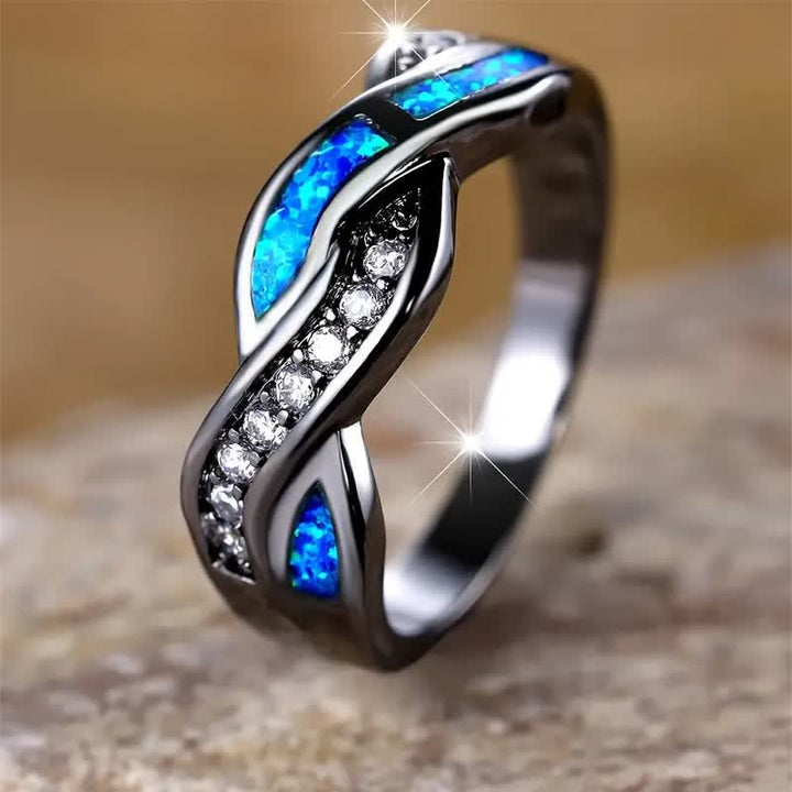 Anello Olivenorma in oro nero con opale blu ondulato e zircone