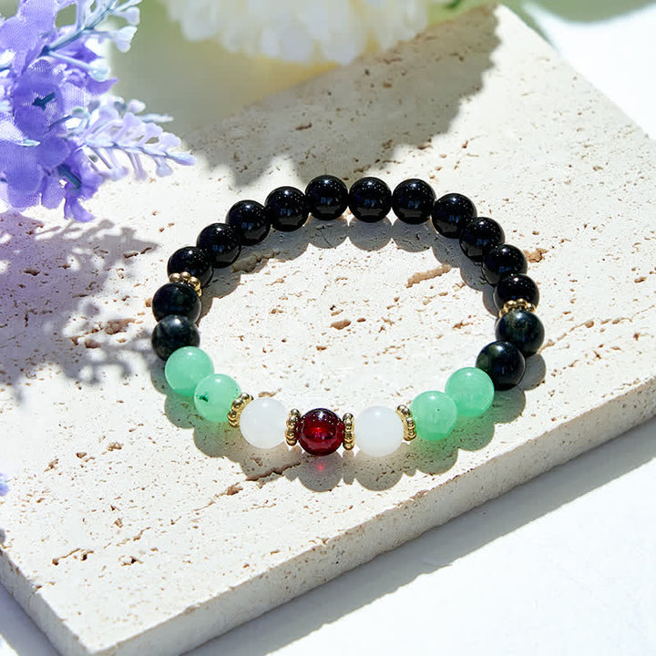 Bracciale Olivenorma in perle di ossidiana naturale e granato 
