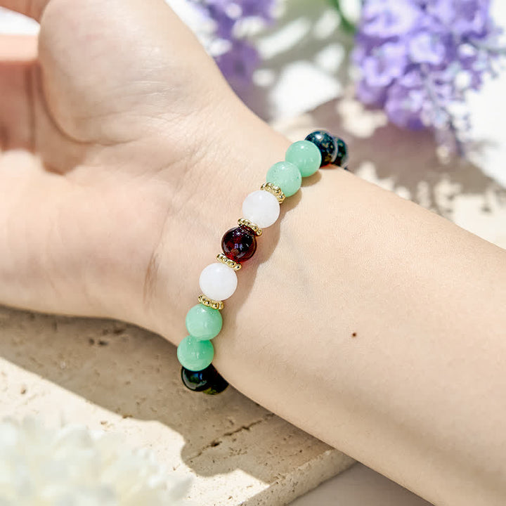 Bracciale Olivenorma in perle di ossidiana naturale e granato 
