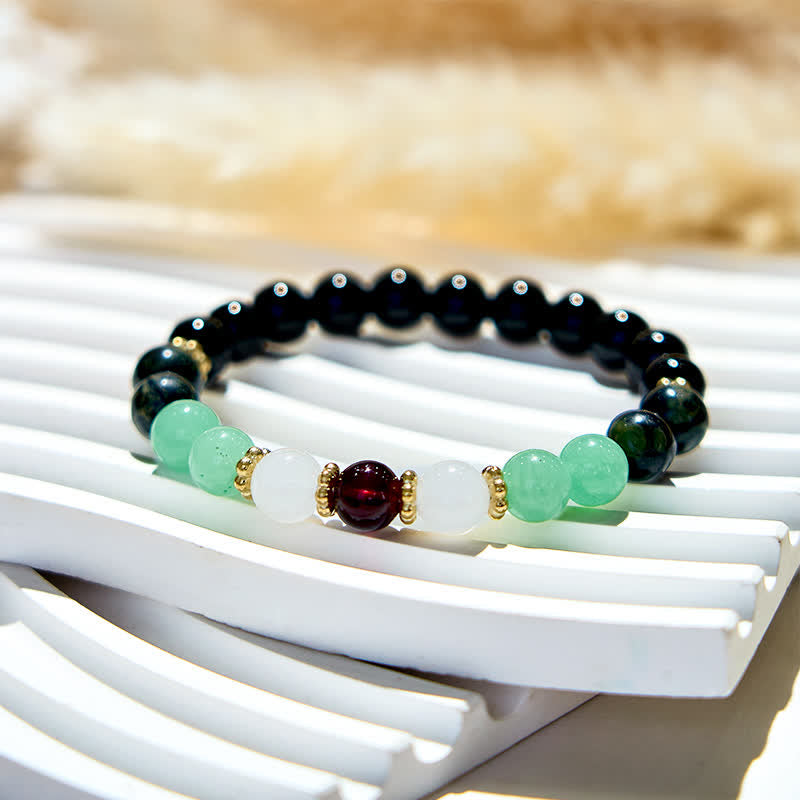 Bracciale Olivenorma in perle di ossidiana naturale e granato 