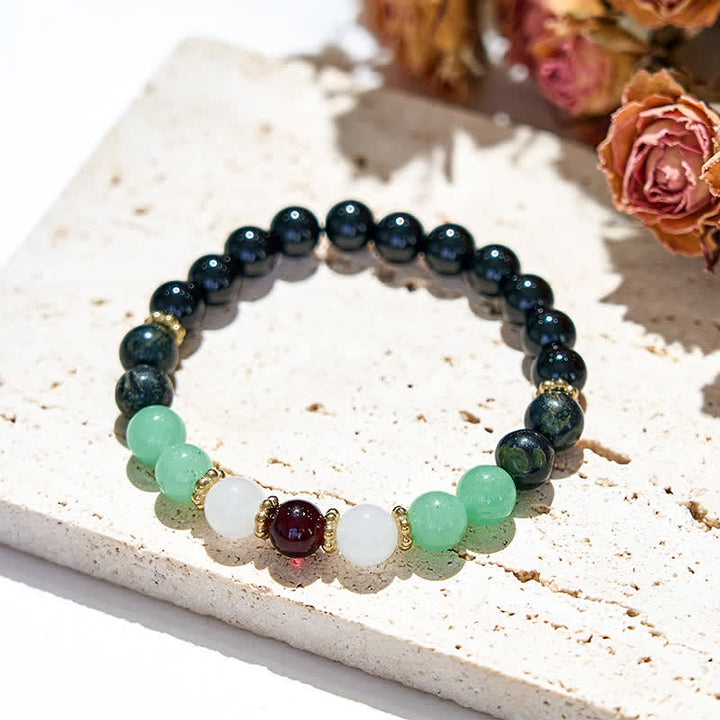 Bracciale Olivenorma in perle di ossidiana naturale e granato 