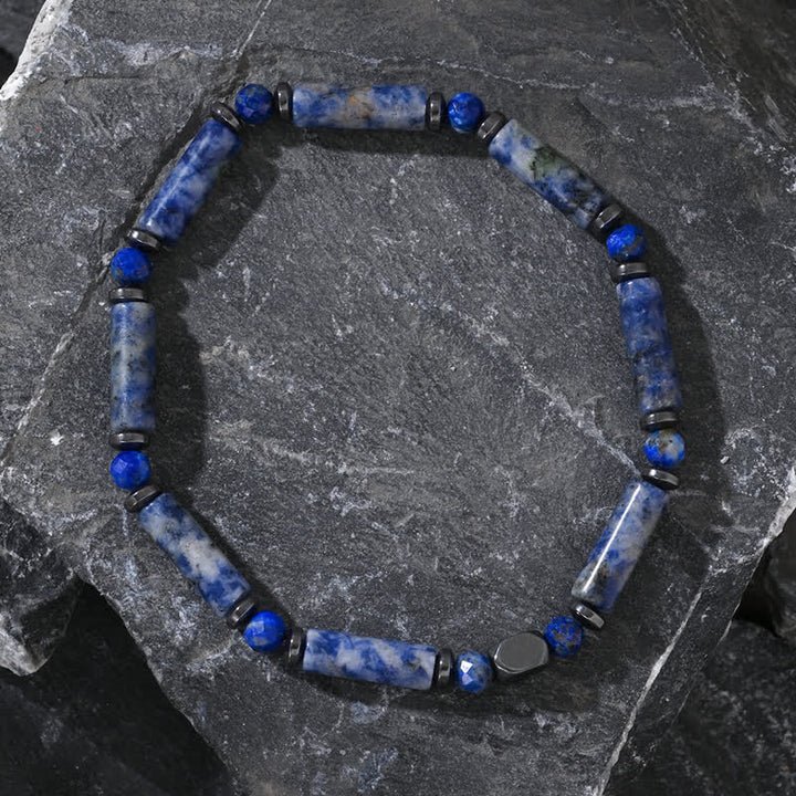 Bracciale Olivenorma con perline di sodalite blu e strisce di ematite naturale 