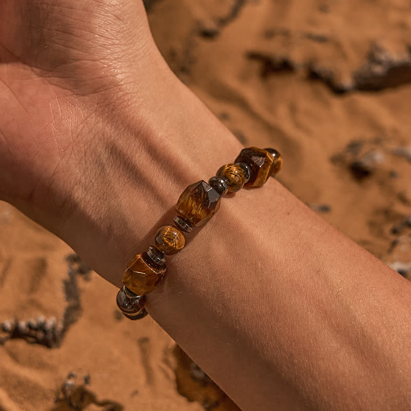 Bracciale Olivenorma con perline in pietra lavica sfaccettata con occhio di tigre 