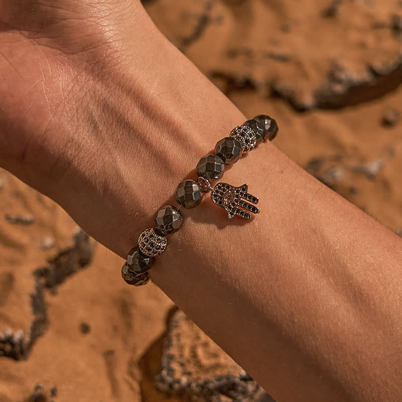Olivenorma Bracciale con ciondolo Hamsa in perline di ematite
