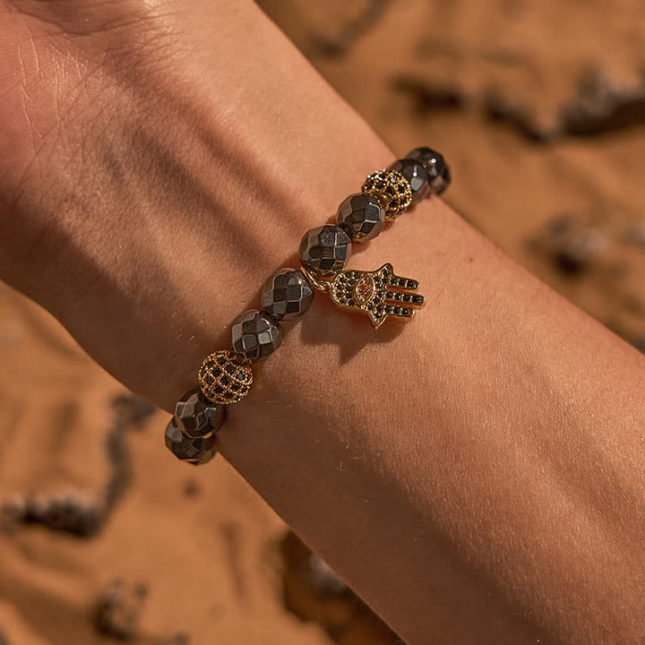 Olivenorma Bracciale con ciondolo Hamsa in perline di ematite