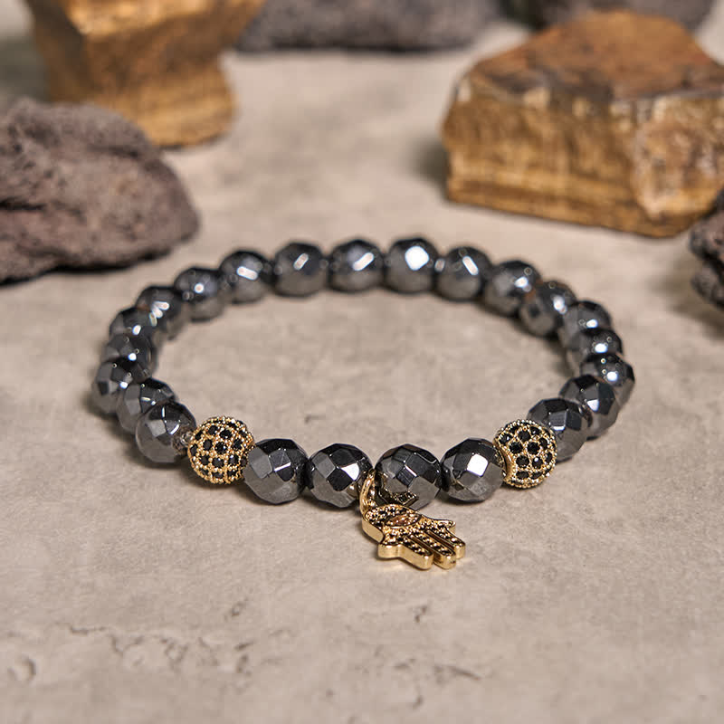Olivenorma Bracciale con ciondolo Hamsa in perline di ematite