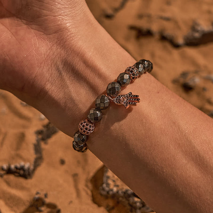 Olivenorma Bracciale con ciondolo Hamsa in perline di ematite