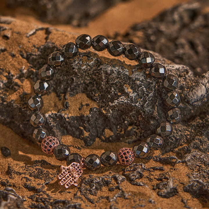 Olivenorma Bracciale con ciondolo Hamsa in perline di ematite