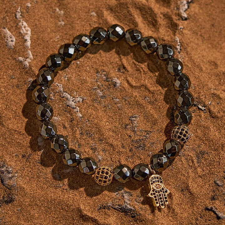 Olivenorma Bracciale con ciondolo Hamsa in perline di ematite