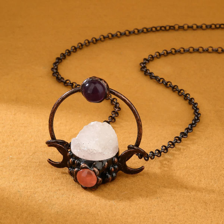 Collana Olivenorma con ciondolo a doppia luna in metallo e quarzo trasparente