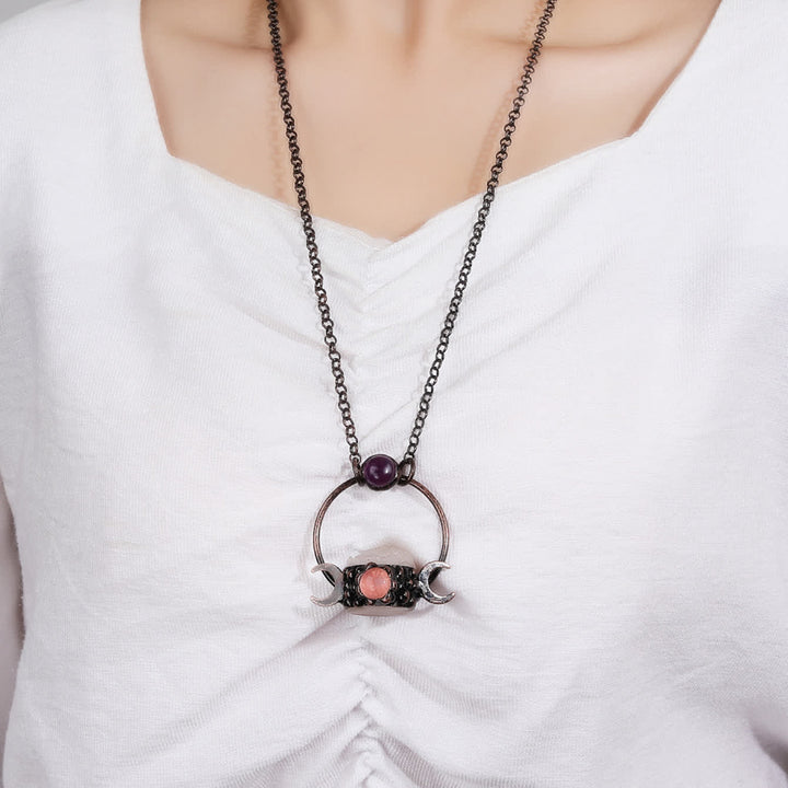 Collana Olivenorma con ciondolo a doppia luna in metallo e quarzo trasparente