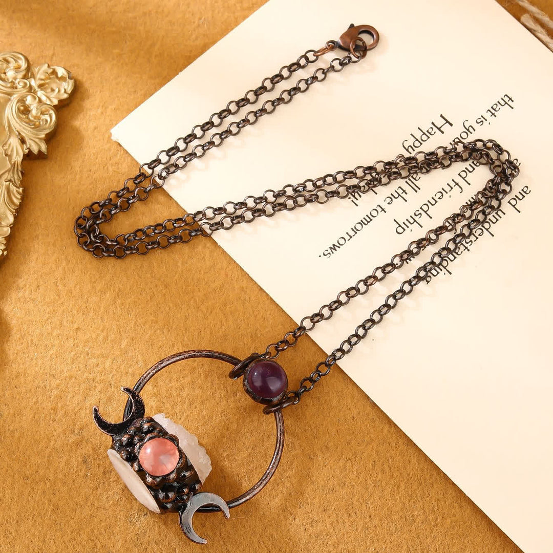 Collana Olivenorma con ciondolo a doppia luna in metallo e quarzo trasparente