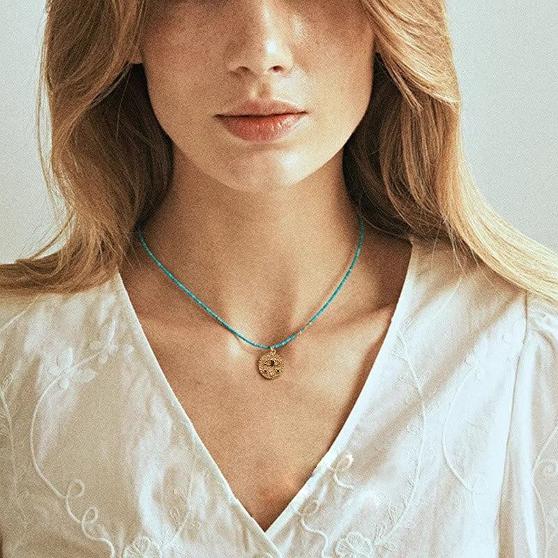 Collana con ciondolo anti-malocchio Olivenorma e perline turchesi