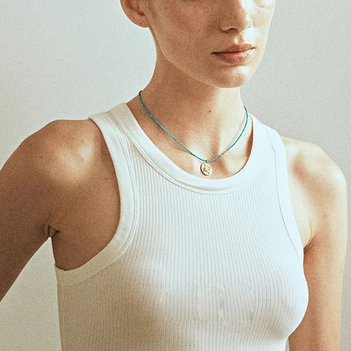 Collana con ciondolo anti-malocchio Olivenorma e perline turchesi