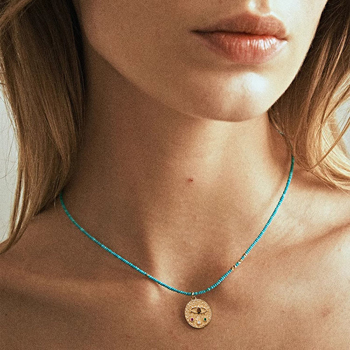 Collana con ciondolo anti-malocchio Olivenorma e perline turchesi