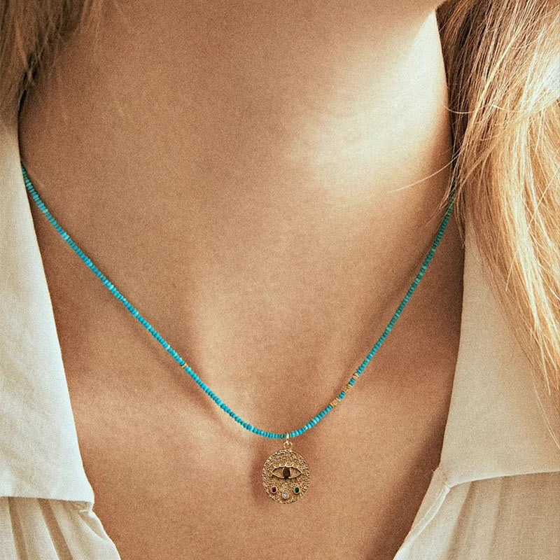 Collana con ciondolo anti-malocchio Olivenorma e perline turchesi