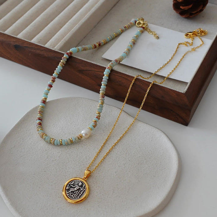 Collana di perline impilate in pietra blu dell'imperatore Olivenorma