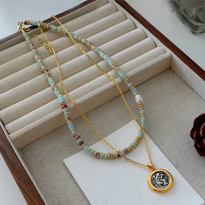 Collana di perline impilate in pietra blu dell'imperatore Olivenorma