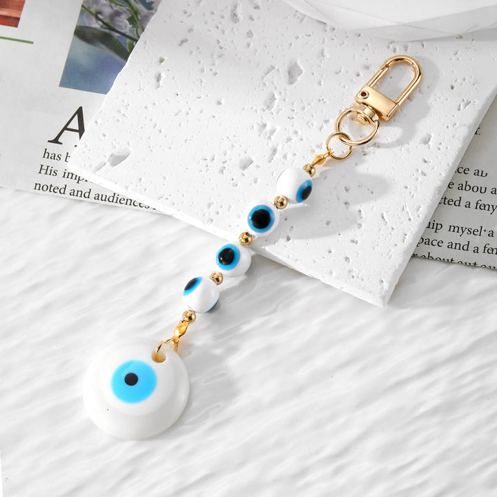 Olivenorma Portachiavi in resina con occhio malvagio fatto a mano