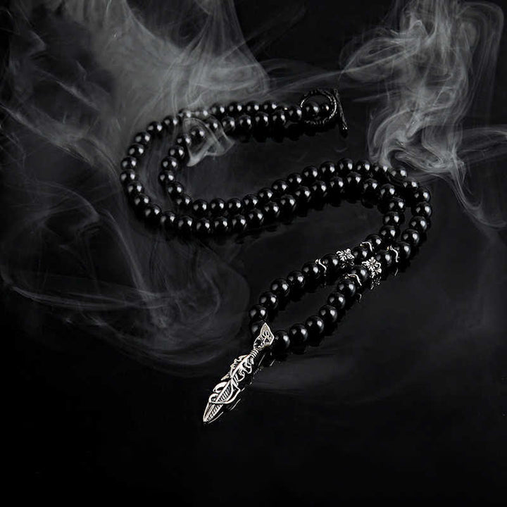 Olivenorma Collana con ciondolo in piuma di metallo con perle di ossidiana da 6 mm