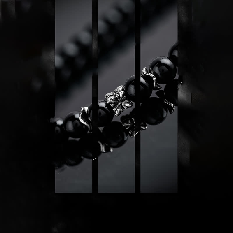 Olivenorma Collana con ciondolo in piuma di metallo con perle di ossidiana da 6 mm