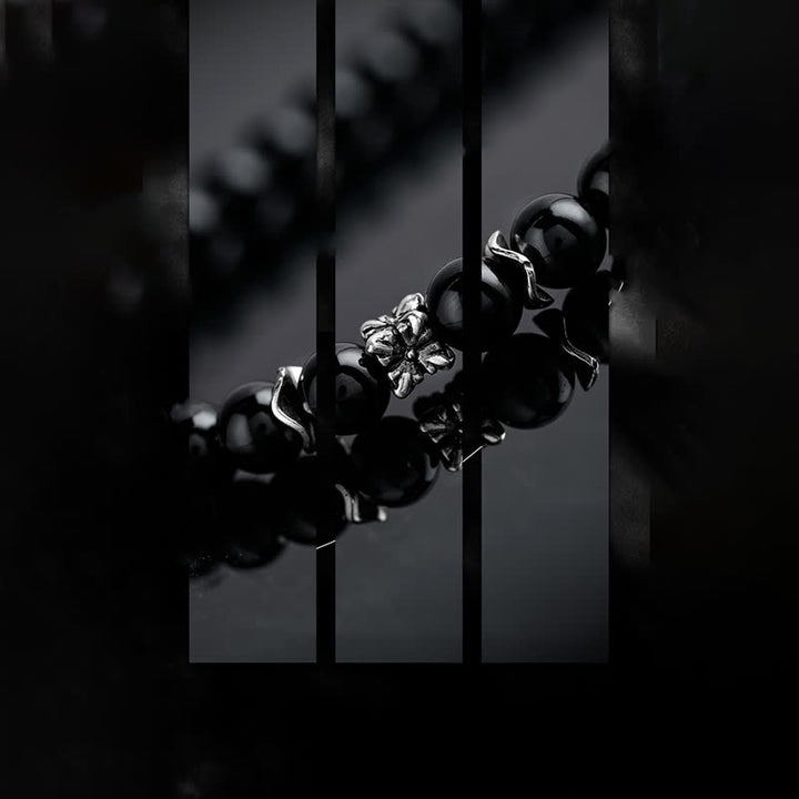 Olivenorma Collana con ciondolo in piuma di metallo con perle di ossidiana da 6 mm