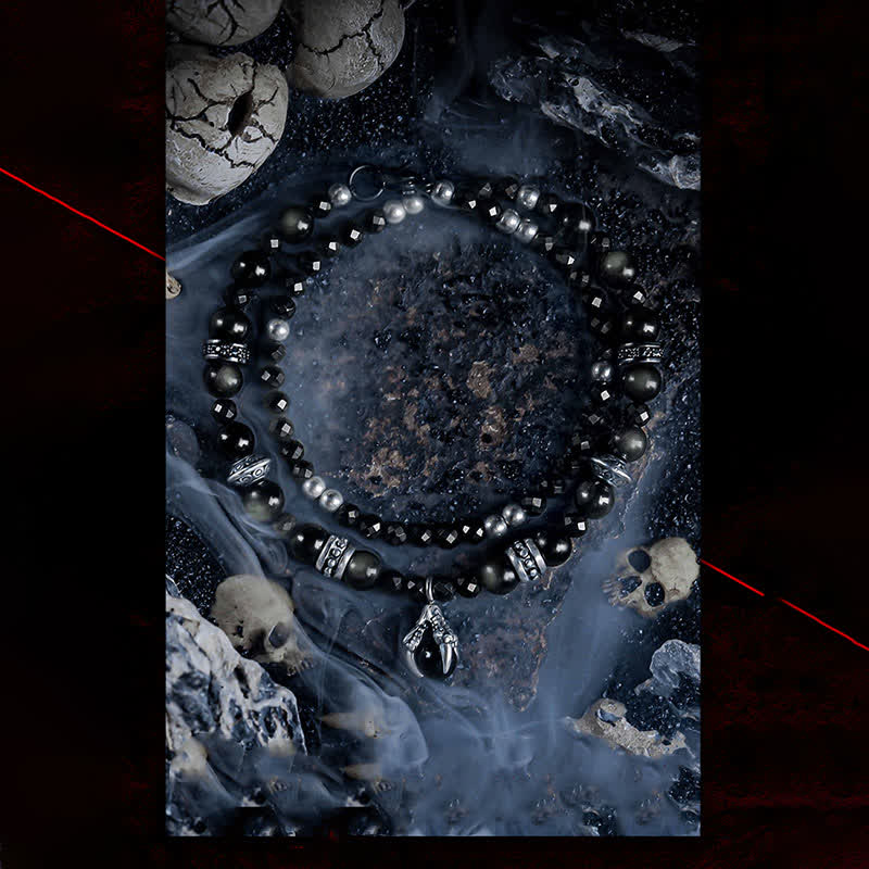 Bracciale Olivenorma con ciondolo a forma di artiglio del diavolo in perline di ossidiana d'argento 