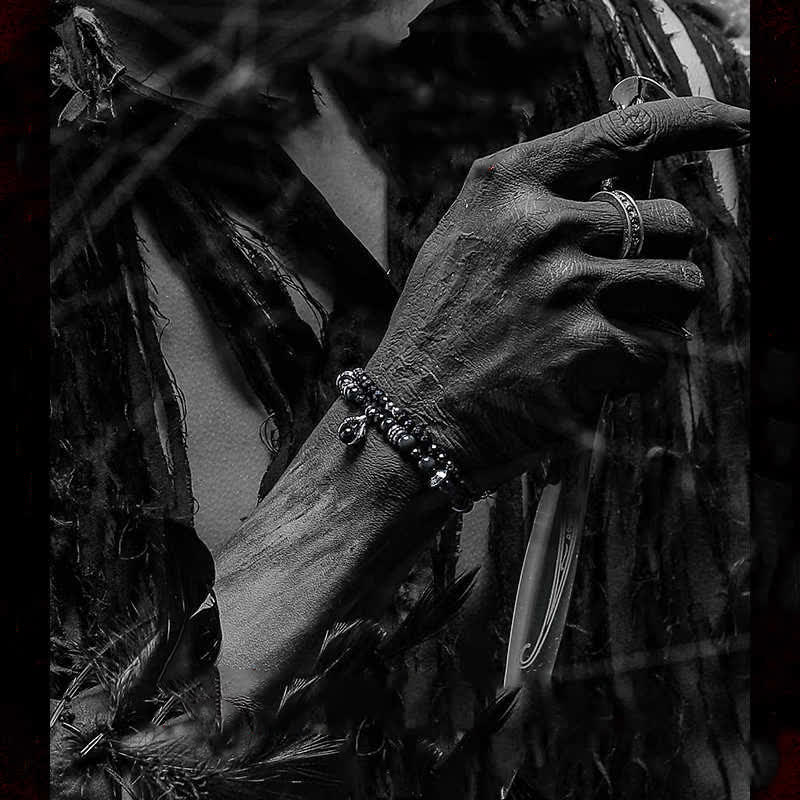 Bracciale Olivenorma con ciondolo a forma di artiglio del diavolo in perline di ossidiana d'argento 