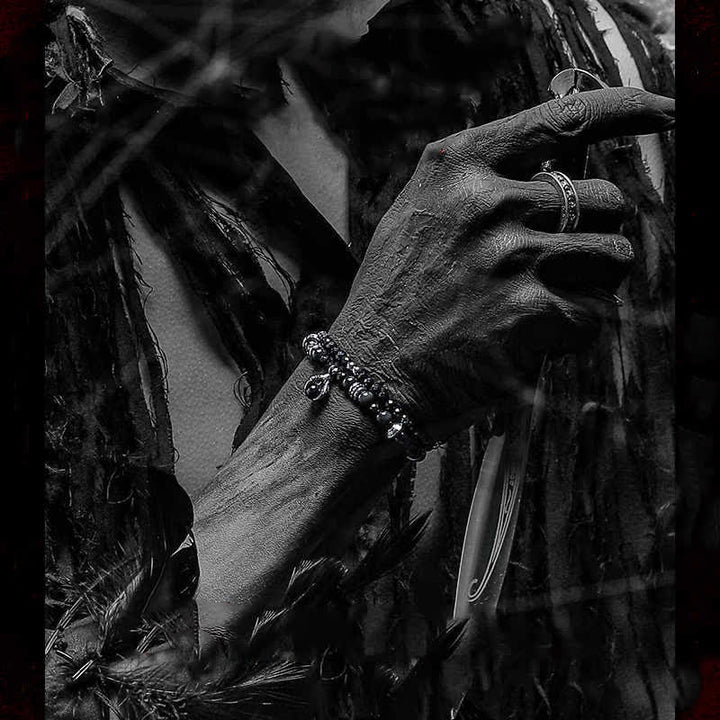 Bracciale Olivenorma con ciondolo a forma di artiglio del diavolo in perline di ossidiana d'argento 