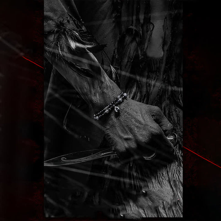 Bracciale Olivenorma con ciondolo a forma di artiglio del diavolo in perline di ossidiana d'argento 