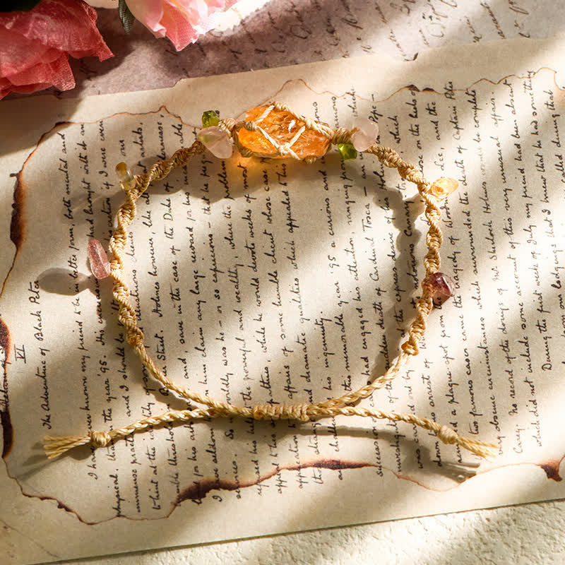 Braccialetto artigianale Olivenorma con fiori intrecciati in cristallo naturale