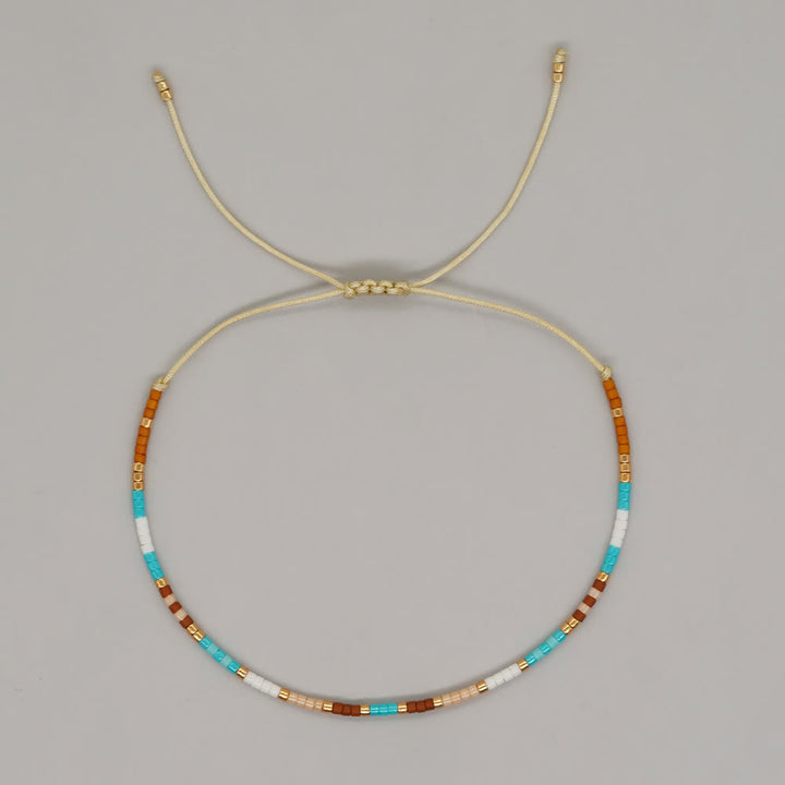 Olivenorma Braccialetto con coulisse in perline di riso colorate 