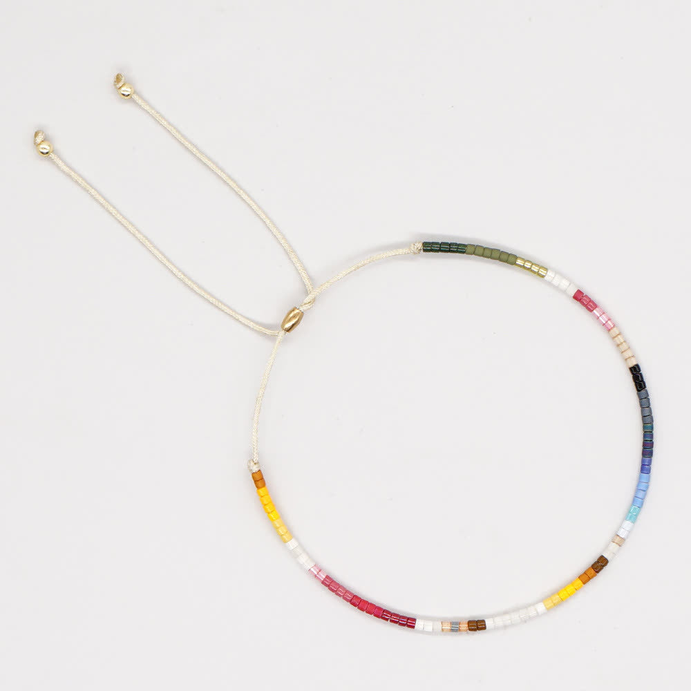 Olivenorma Braccialetto con coulisse beige con perline di riso colorate 