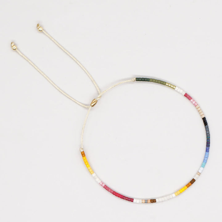 Olivenorma Braccialetto con coulisse beige con perline di riso colorate 