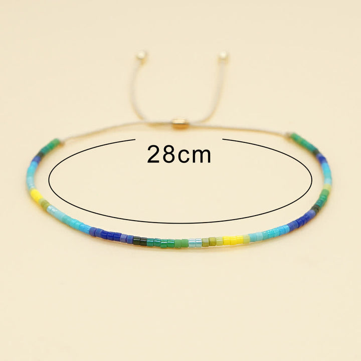 Olivenorma Braccialetto con coulisse beige con perline di riso colorate 