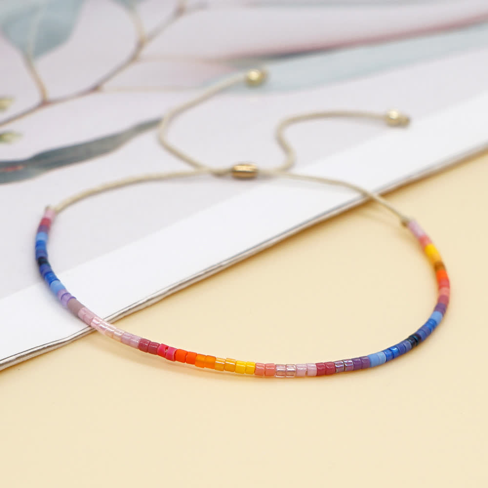 Olivenorma Braccialetto con coulisse beige con perline di riso colorate 