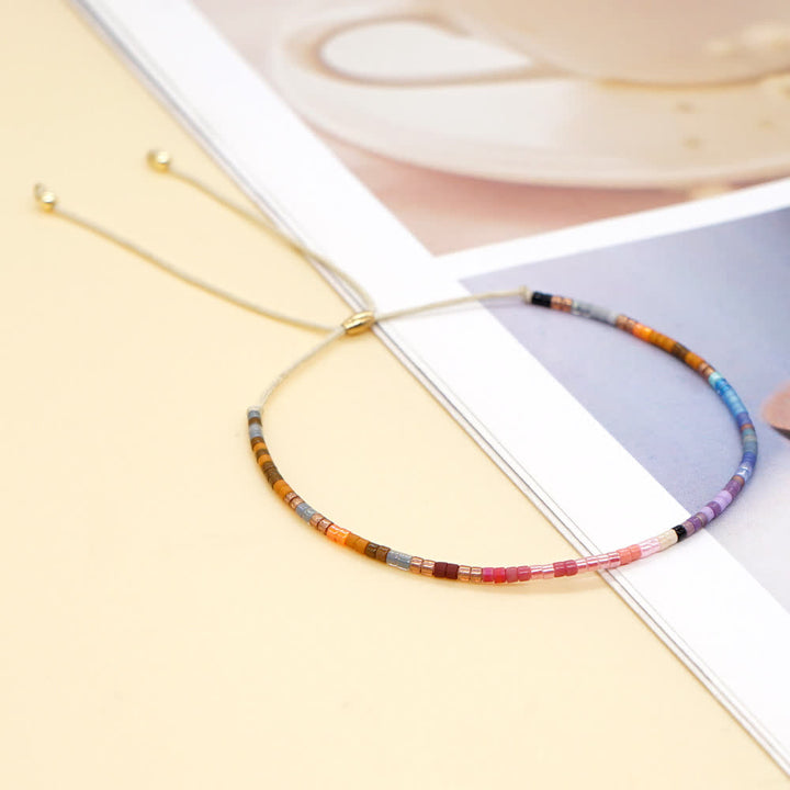 Olivenorma Braccialetto con coulisse beige con perline di riso colorate 