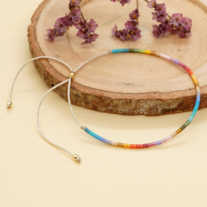 Olivenorma Braccialetto con coulisse beige con perline di riso colorate 