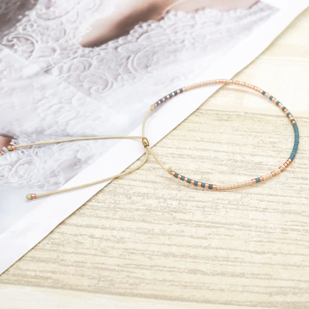 Olivenorma Braccialetto con coulisse beige con perline di riso colorate 